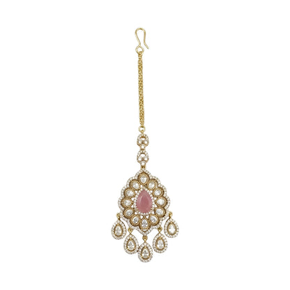 Gold plated pink stone Kundan maang tikka with Polki-inspired white stones and dangling charms for bridal wedding and festive wear.