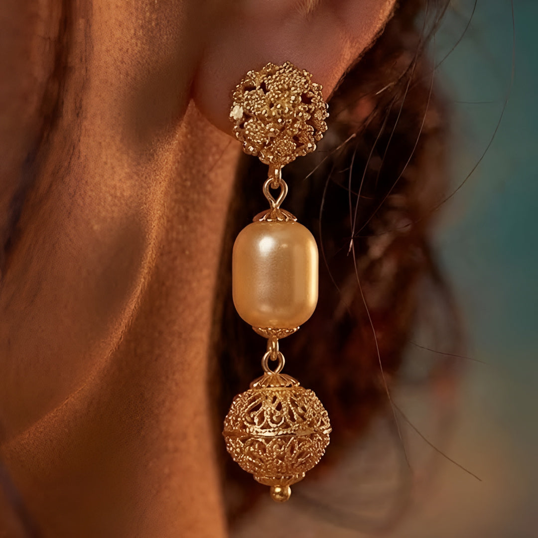 Elegant multi-layer ivory pearl beaded necklace set with gold-tone filigree accents and matching drop earrings for women.