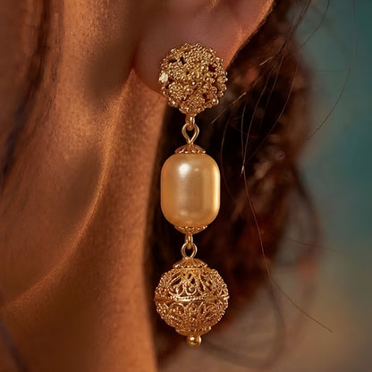 Elegant multi-layer ivory pearl beaded necklace set with gold-tone filigree accents and matching drop earrings for women.