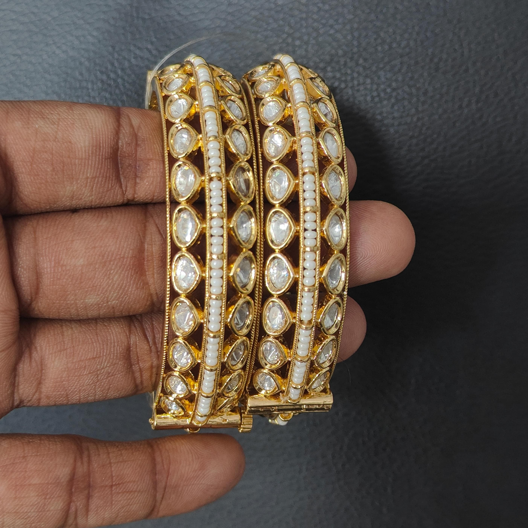 Elegant Kundan pearl-studded gold finish bangles for women – traditional bridal jewelry set