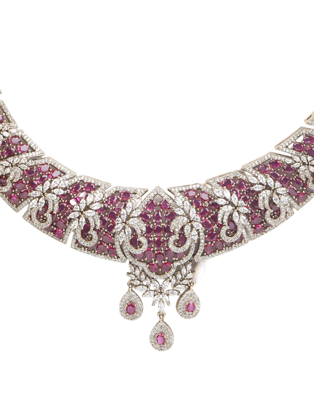 Gold-tone statement necklace set with pink ruby-style stones and clear crystals in an intricate floral design, paired with matching chandelier earrings featuring drop accents.