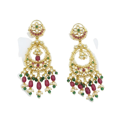 Antique gold Kundan Chandbali earrings with ruby and green stones, pearl border, and elegant bead danglers for women.