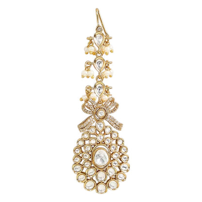Gold-plated Kundan maang tikka with sparkling clear stones, pearl bead drops, and an elegant bridal design for weddings and festive wear.