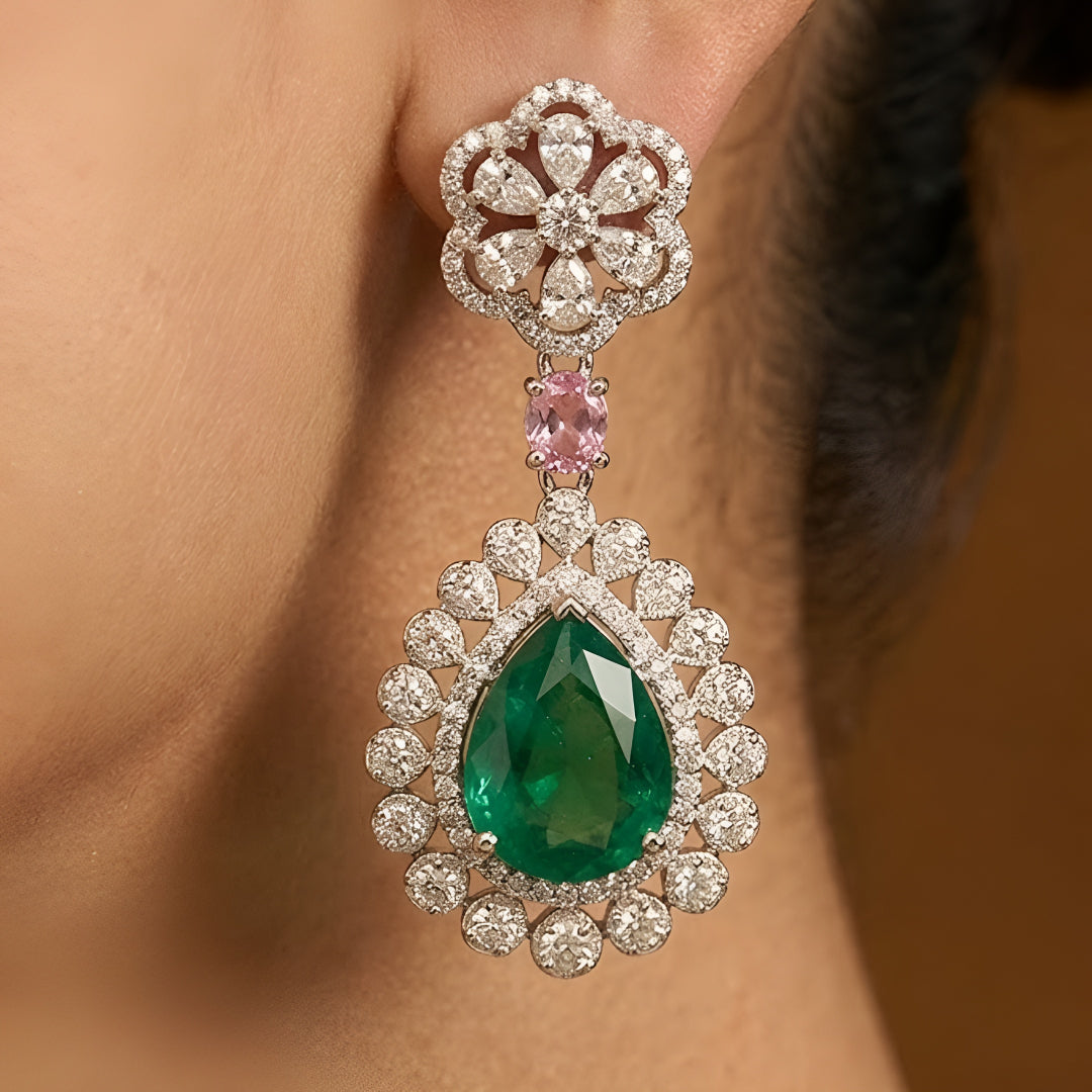 Traditional emerald green kundan choker necklace set with floral motifs and matching drop earrings for bridal and festive wear.