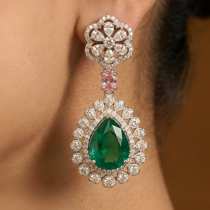 Traditional emerald green kundan choker necklace set with floral motifs and matching drop earrings for bridal and festive wear.