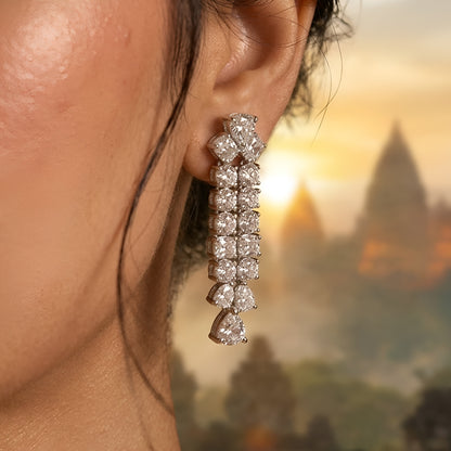 Silver-tone layered crystal necklace with matching drop earrings featuring sparkling clear stones in an elegant bridal jewelry design.