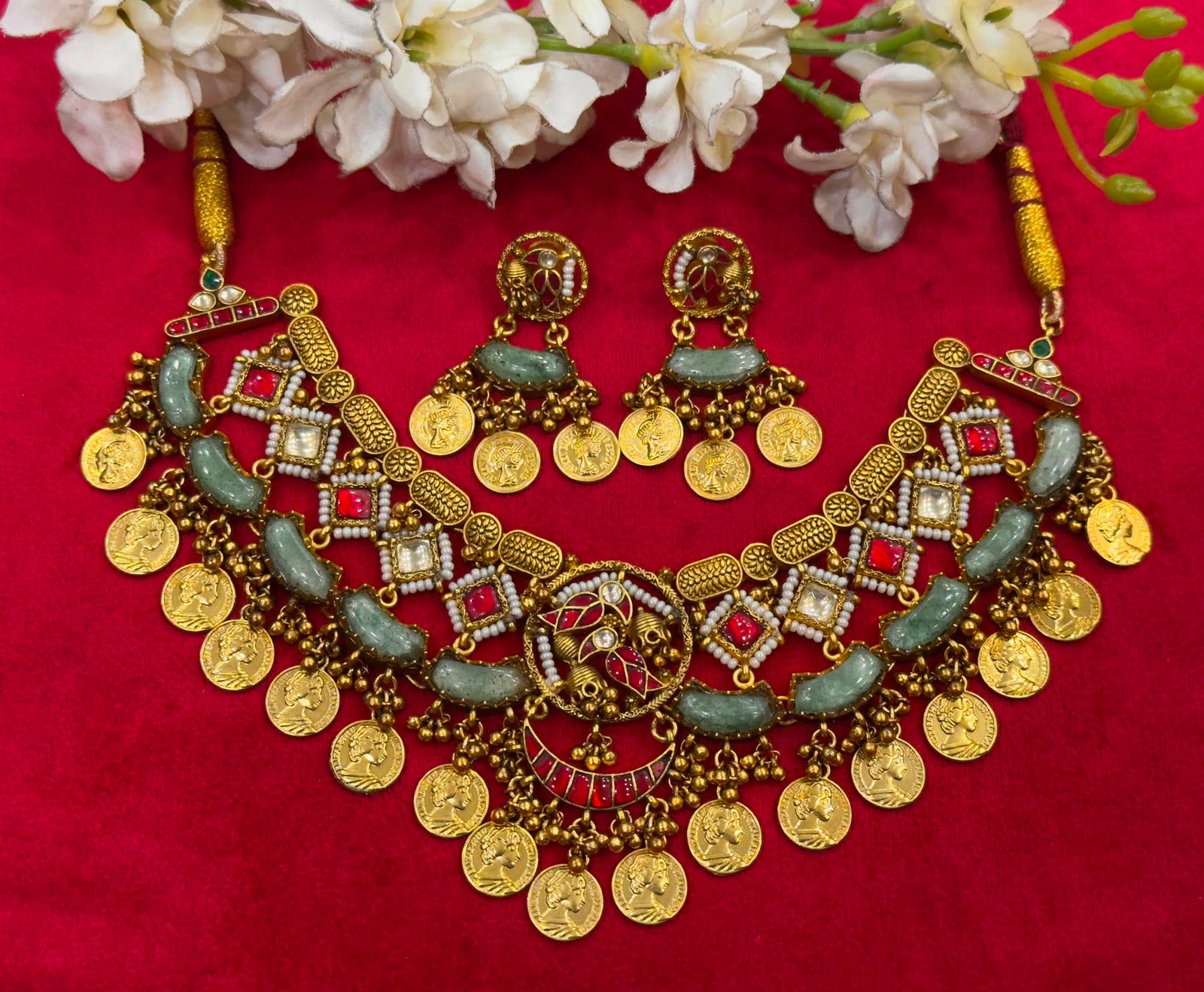 "Antique gold coin necklace set with kemp stones, green beads, and matching jhumka earrings, South Indian temple jewellery"
