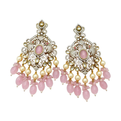 Pink Kundan Chandbali earrings featuring a blush pink center stone, sparkling Kundan detailing, pearl drops, and pink bead tassels with a gold-plated finish.