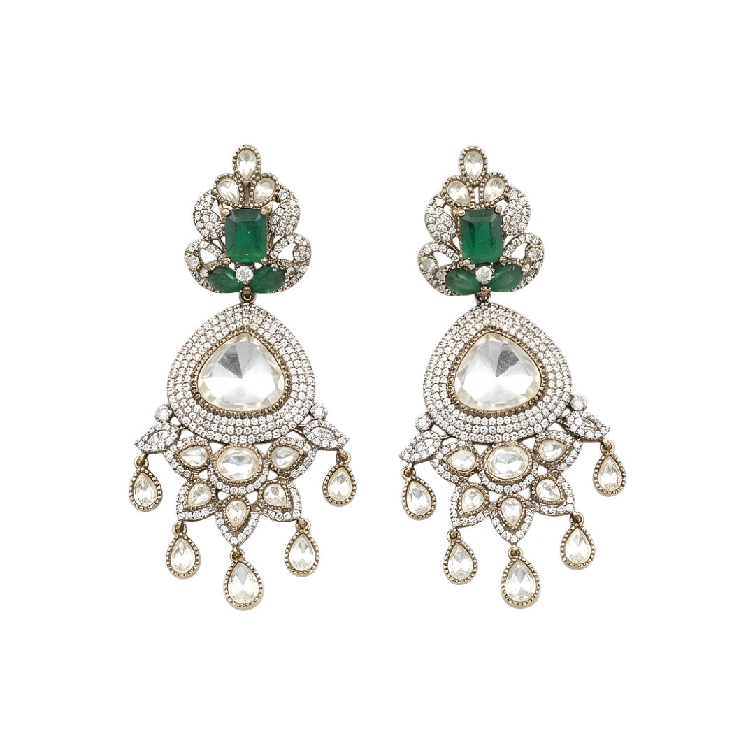 Luxury gold-plated statement earrings with emerald green stones, Kundan stones, sparkling American diamonds, and teardrop danglers for women.