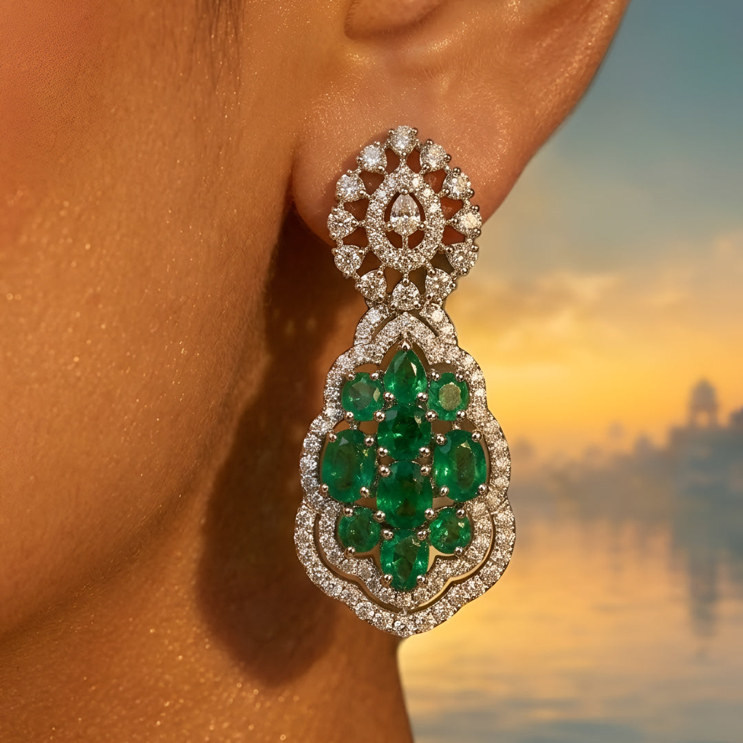 Silver-toned emerald green crystal choker necklace set featuring sparkling stone detailing and matching statement drop earrings on a white background.