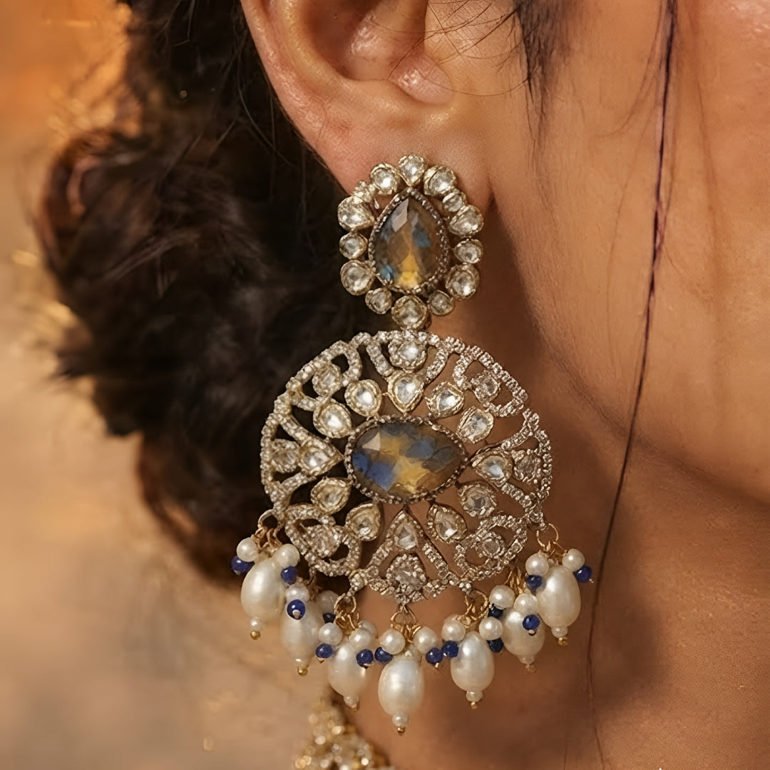 Royal blue stone Kundan choker necklace set with matching statement earrings featuring white Kundan stones, blue center stones, and pearl drop detailing.