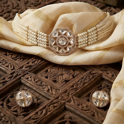 Traditional Kundan pearl choker necklace set with gold-tone finish, multi-strand pearls, and matching stud earrings for bridal and wedding wear.