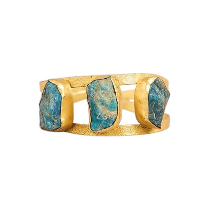 Blue stone gold tone designer cuff bangle with engraved detailing for women