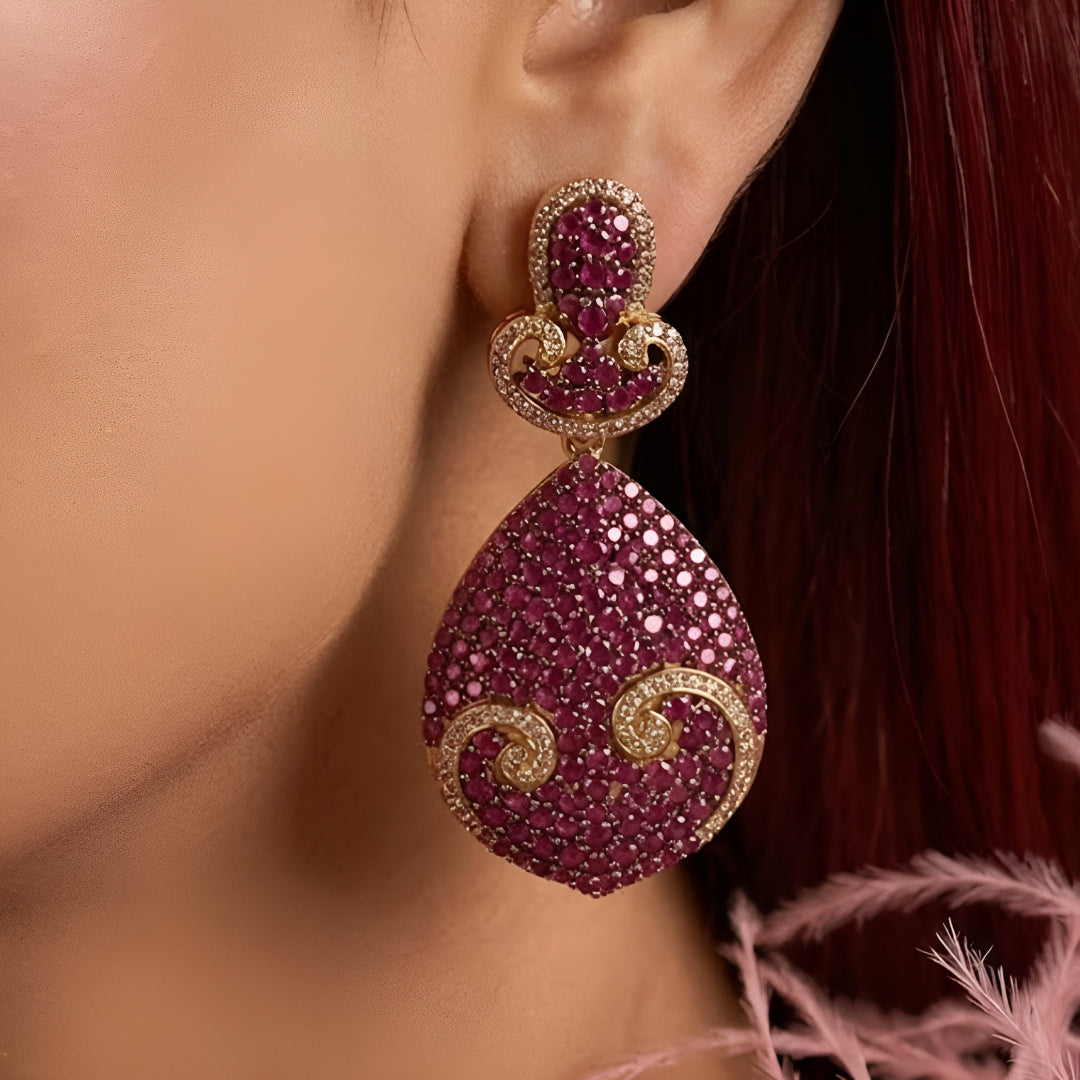 Luxury ruby pink crystal statement choker necklace set with teardrop pendant and matching earrings for weddings and festive occasions.