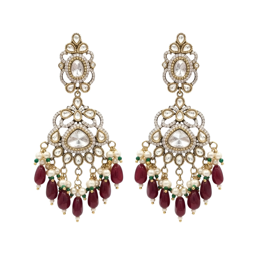 Antique gold Kundan Chandbali earrings with ruby bead drops, pearl clusters, and traditional bridal design for women.