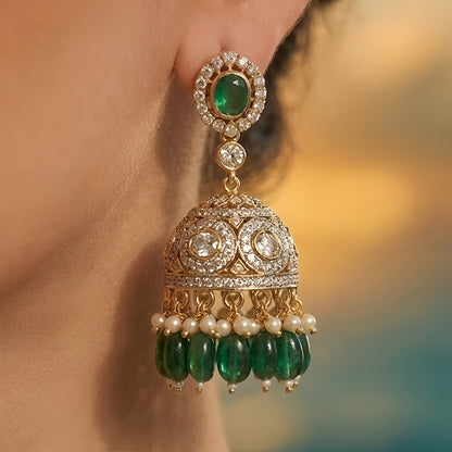 Traditional green Kundan choker necklace set with Polki stones, pearl detailing, green bead drops, and matching jhumka earrings for bridal and wedding wear.