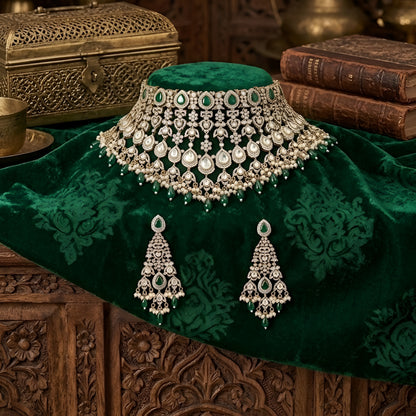 Green Kundan Polki bridal choker necklace set with intricate lattice design, pearl embellishments, green teardrop beads, and matching statement earrings.