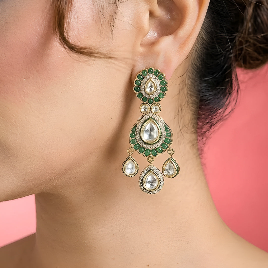 Green Kundan Polki bridal necklace set with matching earrings featuring white stones and emerald green accents in antique gold finish.