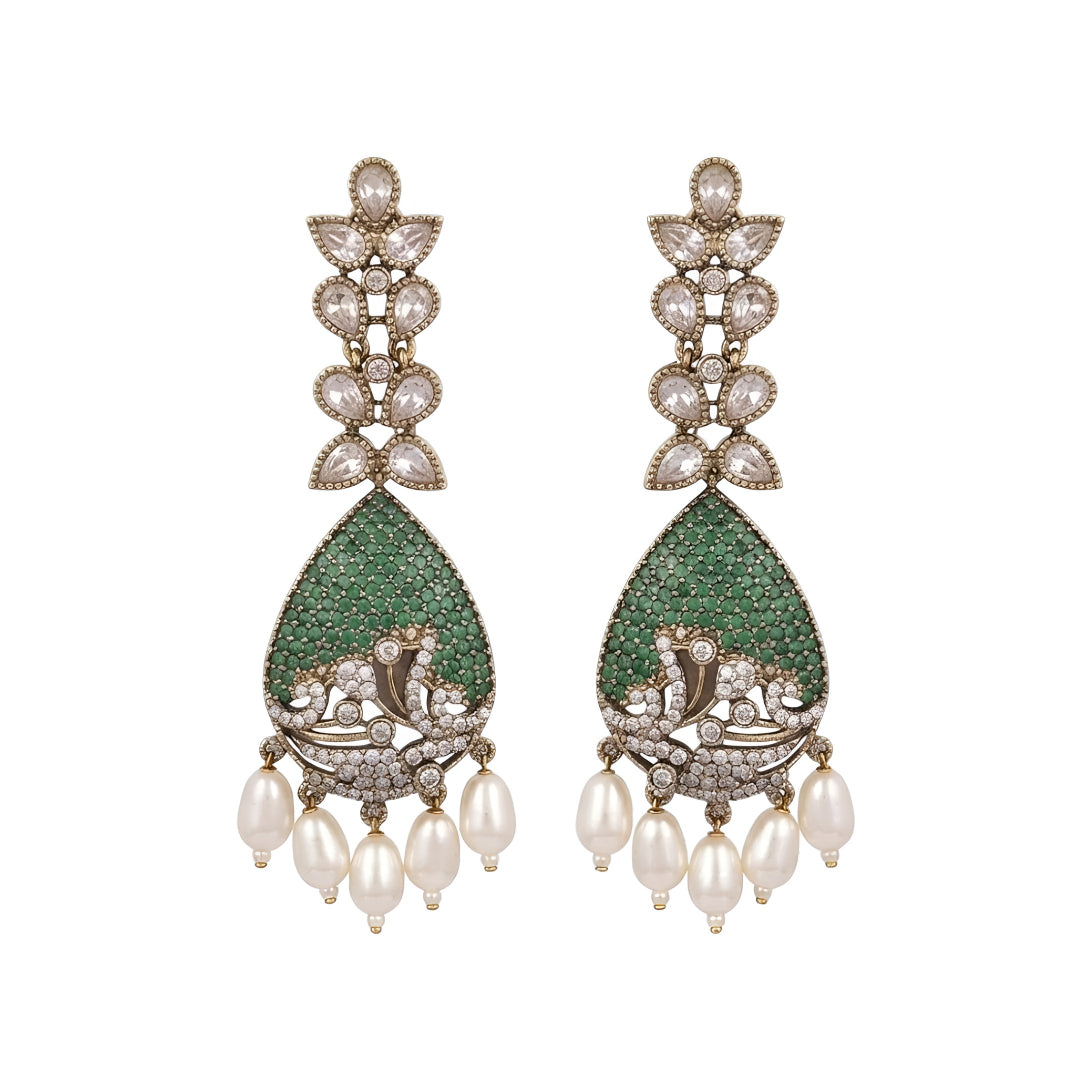 Luxury gold-plated teardrop earrings with emerald green stones, sparkling American diamonds, and pearl drop danglers for women.