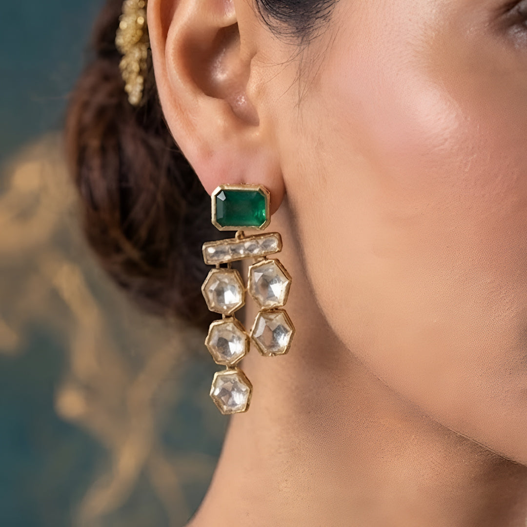 Gold-plated double-layer Kundan necklace set featuring emerald green rectangular stones, Polki-style hexagonal stones, and matching drop earrings for women.