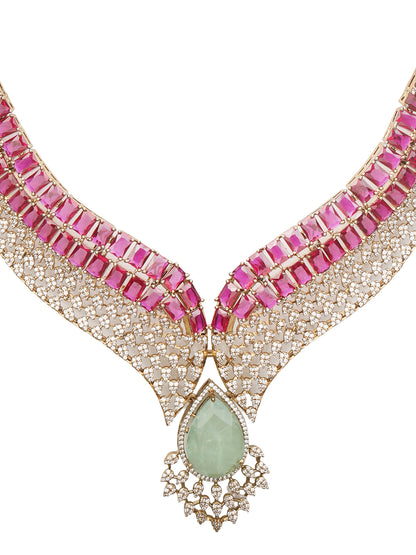Gold plated ruby and emerald statement necklace set with matching earrings, bridal jewelry design with teardrop green stone and crystal detailing