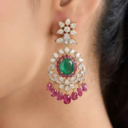 Luxury emerald green kundan choker necklace set with sparkling polki stones, ruby pink accents, and matching chandelier earrings for bridal and wedding wear.