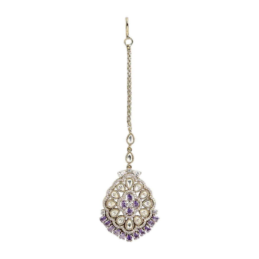 Silver-tone Kundan maang tikka with white stones and purple crystal accents, perfect for bridal, wedding, and festive wear.