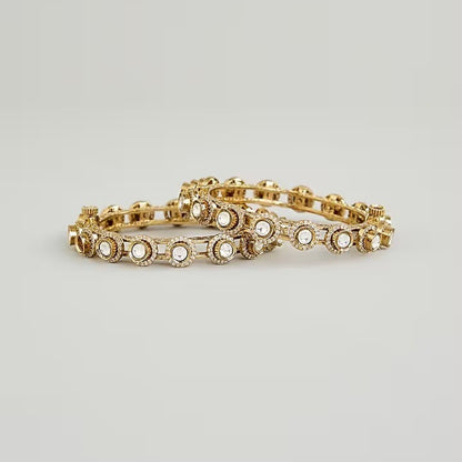 Gold-plated Kundan bangles with round white stone detailing for women, ideal for weddings and festive wear.