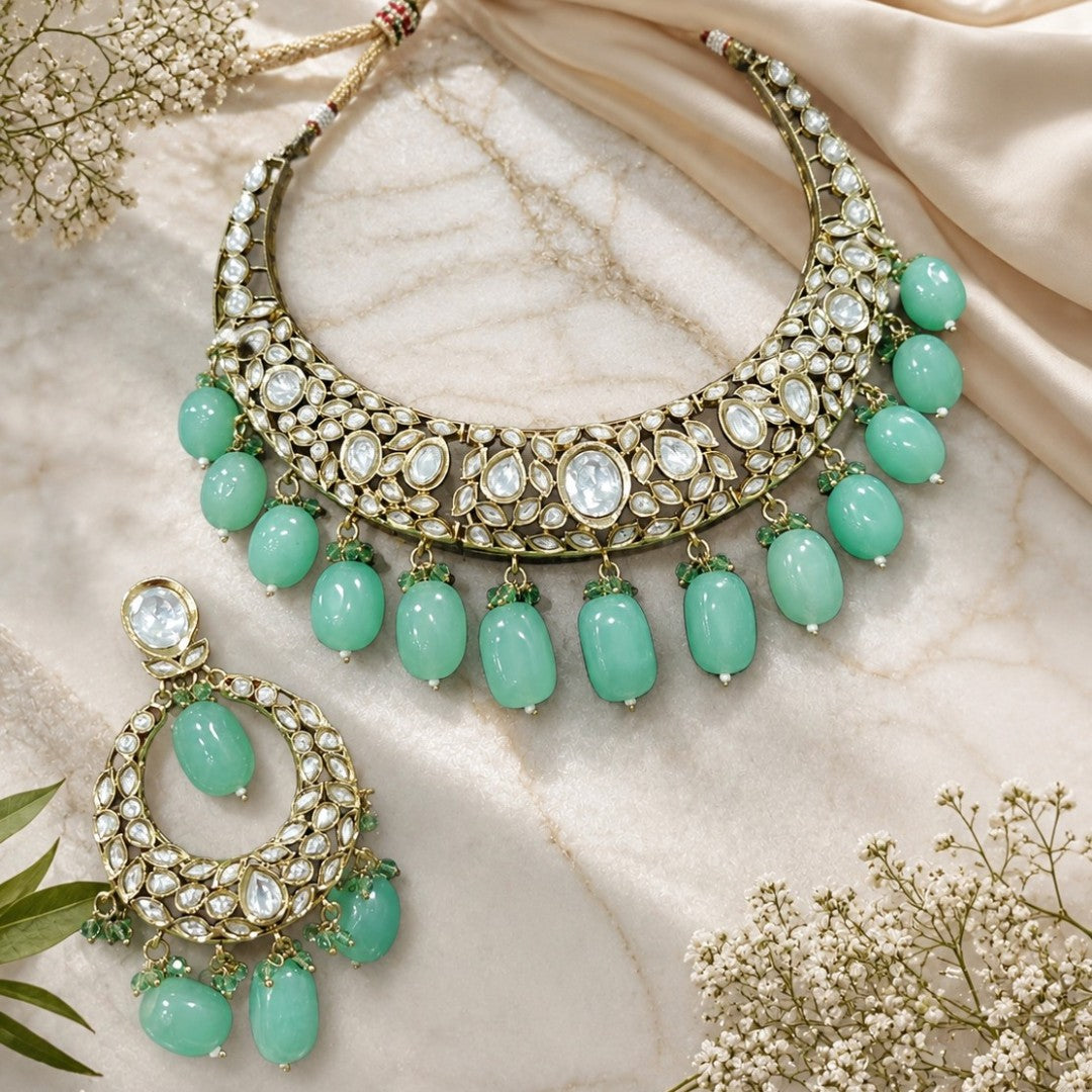 Green Kundan Polki choker necklace set with mint green bead drops and matching statement earrings for bridal, wedding, and traditional ethnic wear.