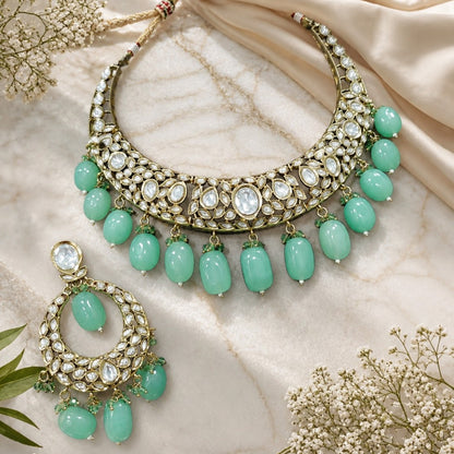 Green Kundan Polki choker necklace set with mint green bead drops and matching statement earrings for bridal, wedding, and traditional ethnic wear.