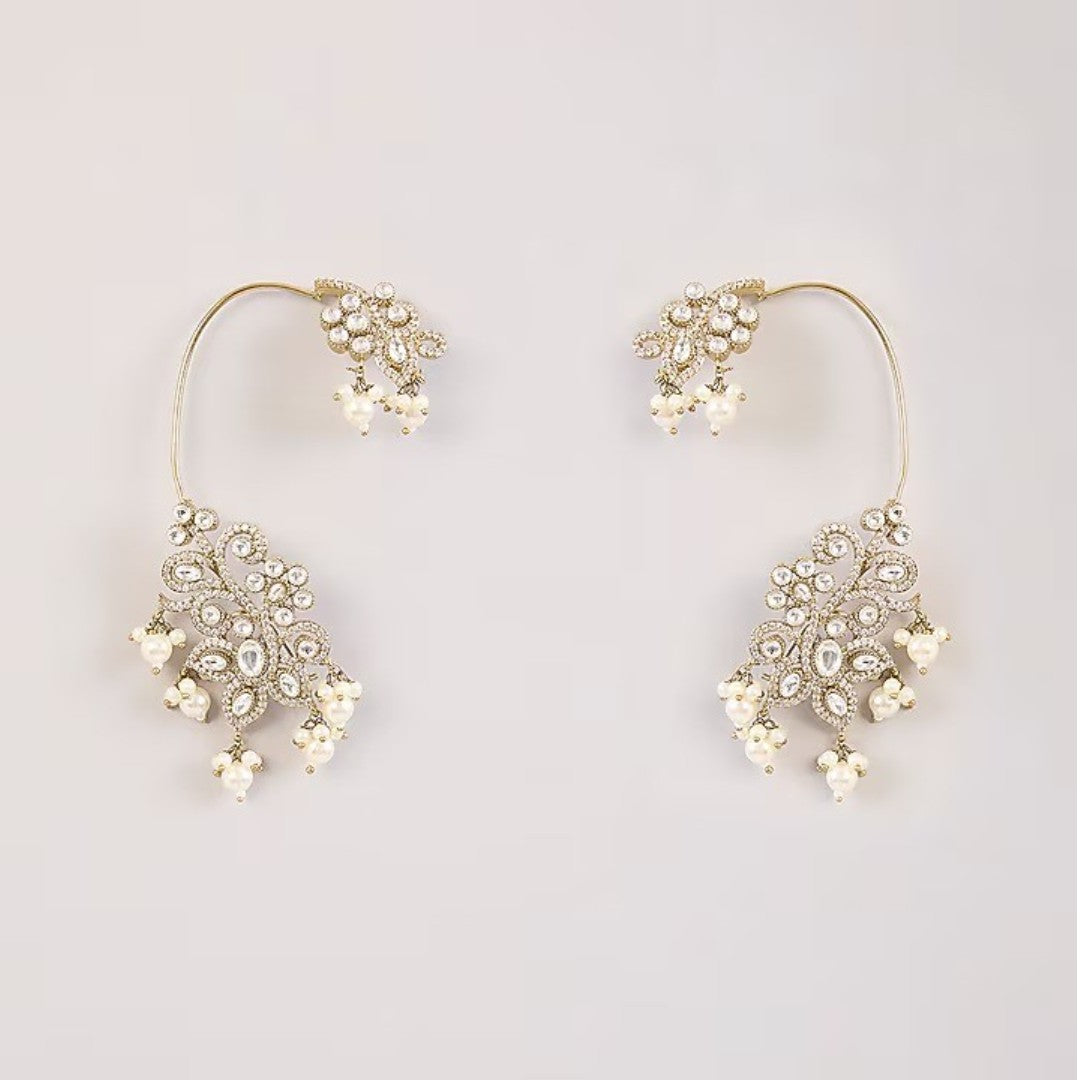 Gold-plated crystal and pearl statement earrings with floral design and dangling pearl accents for weddings and party wear.