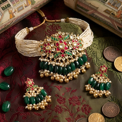 Traditional Kundan pearl choker necklace set with green bead drops and matching earrings in gold-plated finish for bridal and festive wear.