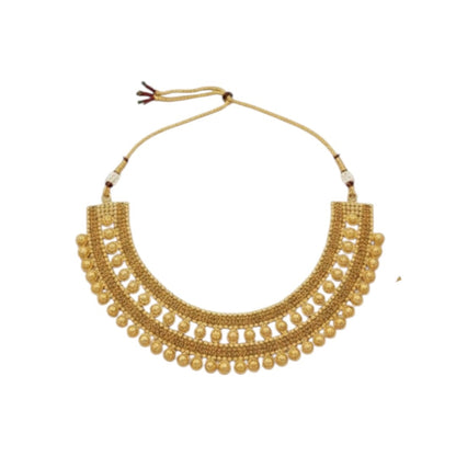 Traditional bridal gold-plated Kundan necklace set with matching earrings and maang tikka displayed on red velvet stand.
