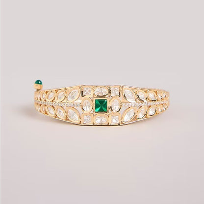 Green stone AD studded gold tone designer kada bracelet with intricate leaf detailing