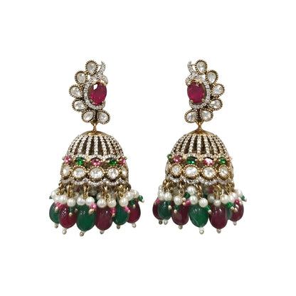 Antique gold Kundan jhumka earrings with ruby center stones, green bead drops, pearl accents, and traditional bridal design for women.