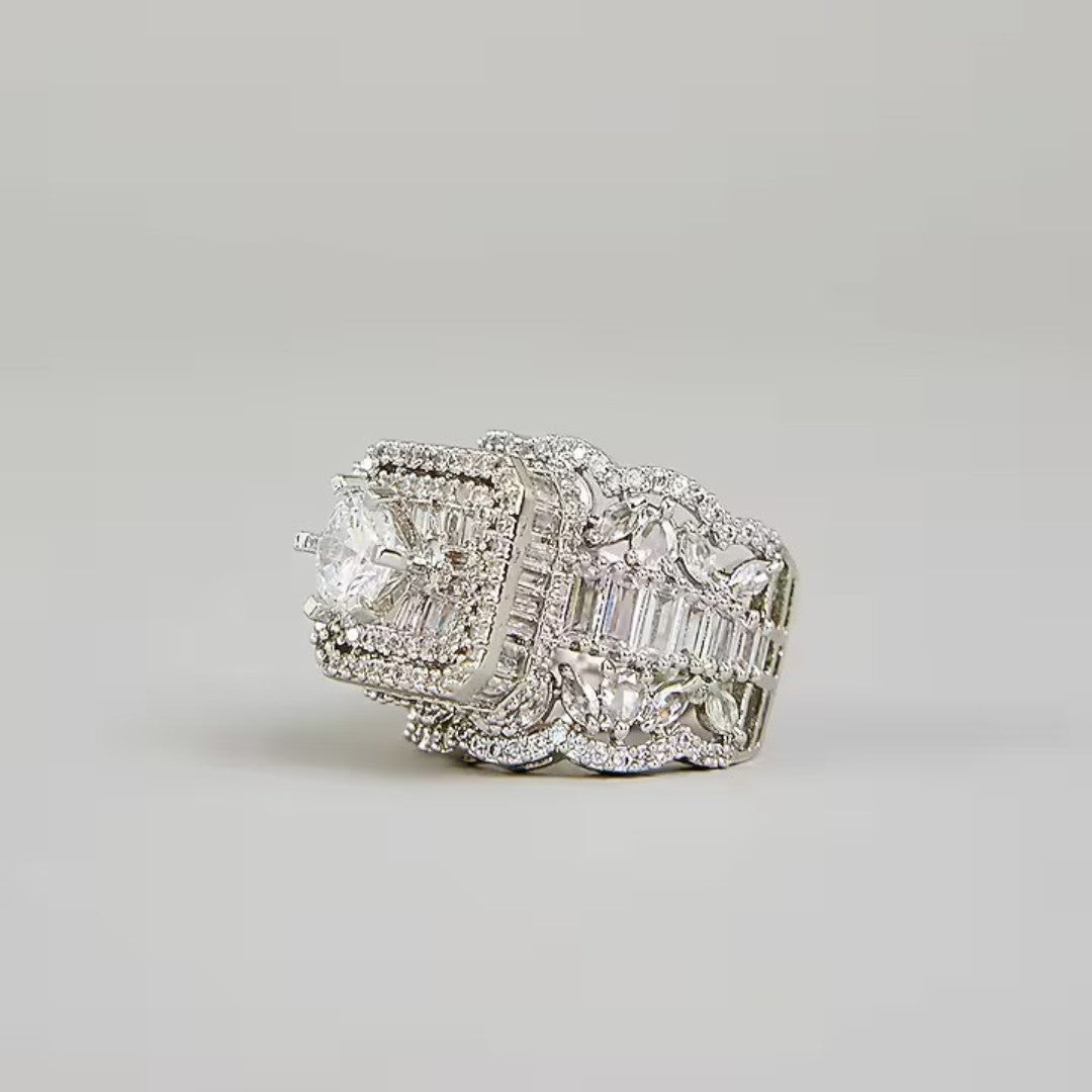 Luxury silver-tone cubic zirconia statement ring with princess-cut center stone and baguette crystal accents