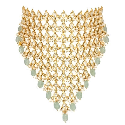 "Woman wearing gold Kundan choker necklace set with green beaded drops and matching chandbali earrings, bridal jewellery"