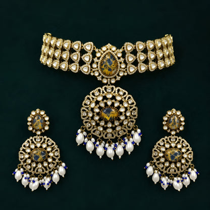 Royal blue stone Kundan choker necklace set with matching statement earrings featuring white Kundan stones, blue center stones, and pearl drop detailing.