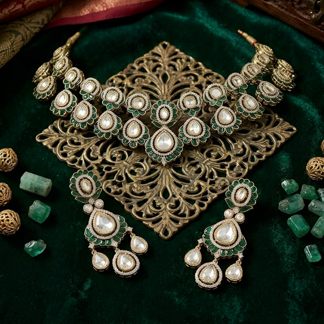 Green Kundan Polki bridal necklace set with matching earrings featuring white stones and emerald green accents in antique gold finish.