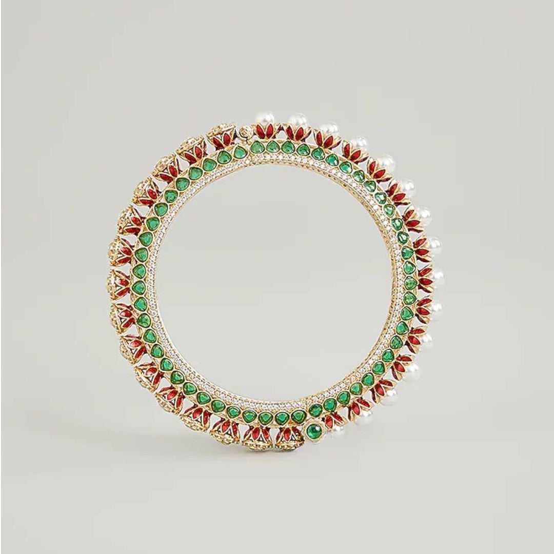 Gold-plated green Kundan bangles with pearl border and sparkling white stones for women.