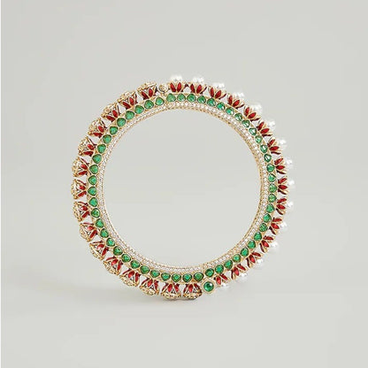 Gold-plated green Kundan bangles with pearl border and sparkling white stones for women.