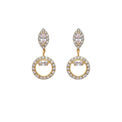 "Gold-tone necklace and earring set with circular and leaf motifs displayed on black velvet stand"