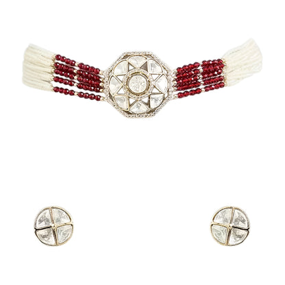 Handcrafted Kundan bracelet with red crystal bead strands and matching round stud earrings on a white background.