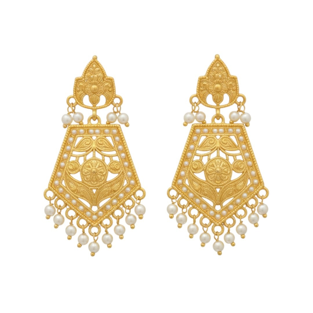 Temple-style gold plated necklace set with long matching earrings on red display stand