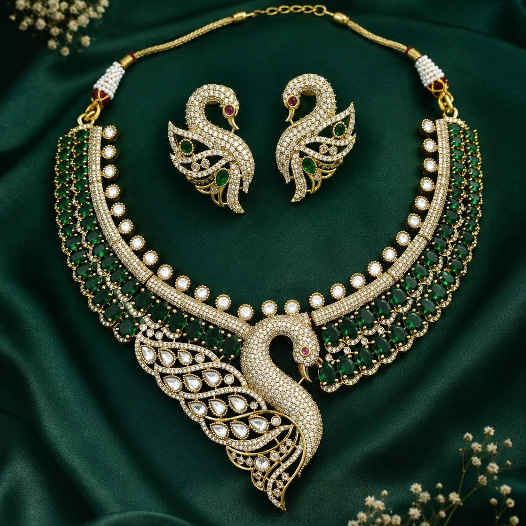 Luxury green swan designer necklace set with American diamonds, emerald green stones, and matching swan earrings for bridal wedding and party wear.