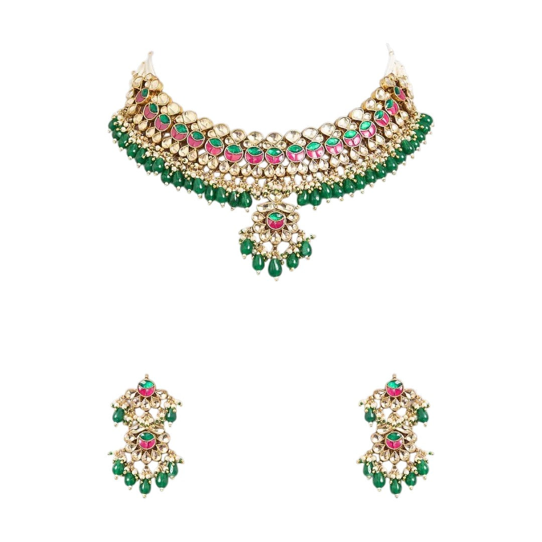 Traditional Kundan choker necklace set with pink stone detailing, green bead drops, and matching earrings in gold-plated finish for bridal wear.