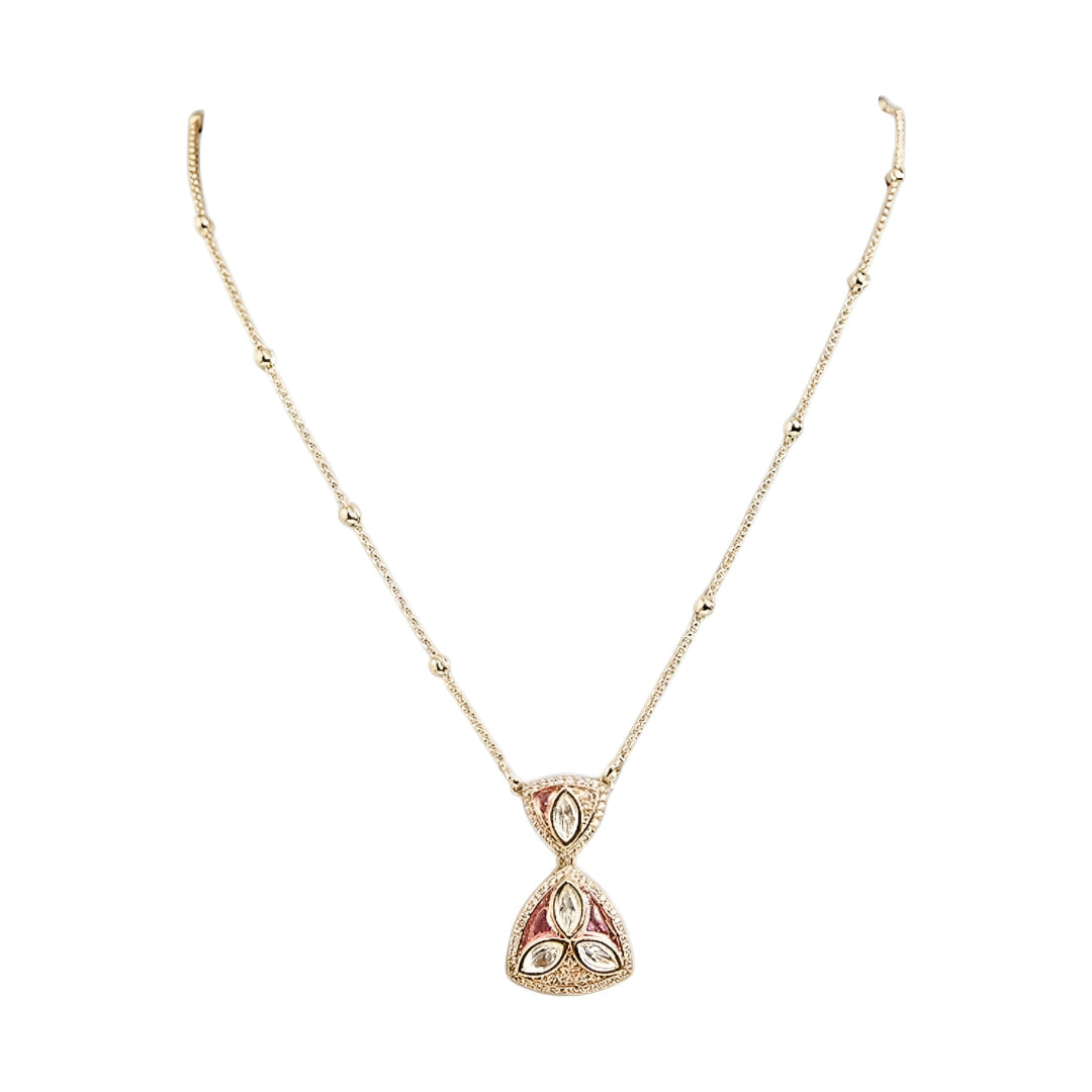 Gold-plated pink stone pendant necklace set with matching stud earrings featuring marquise-cut crystals and elegant enamel detailing.