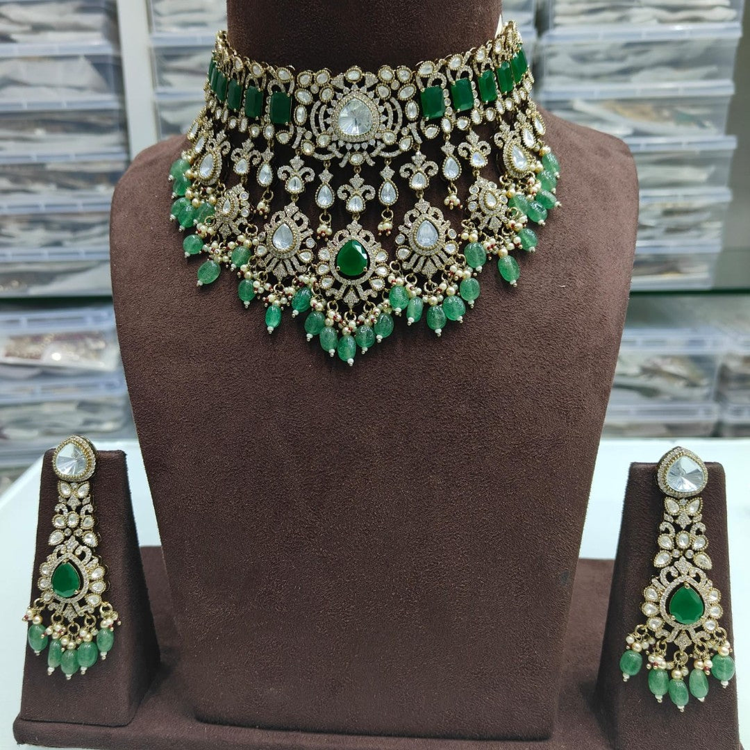 Luxury green stone Kundan choker necklace set with matching long earrings and green bead drops for bridal and wedding wear