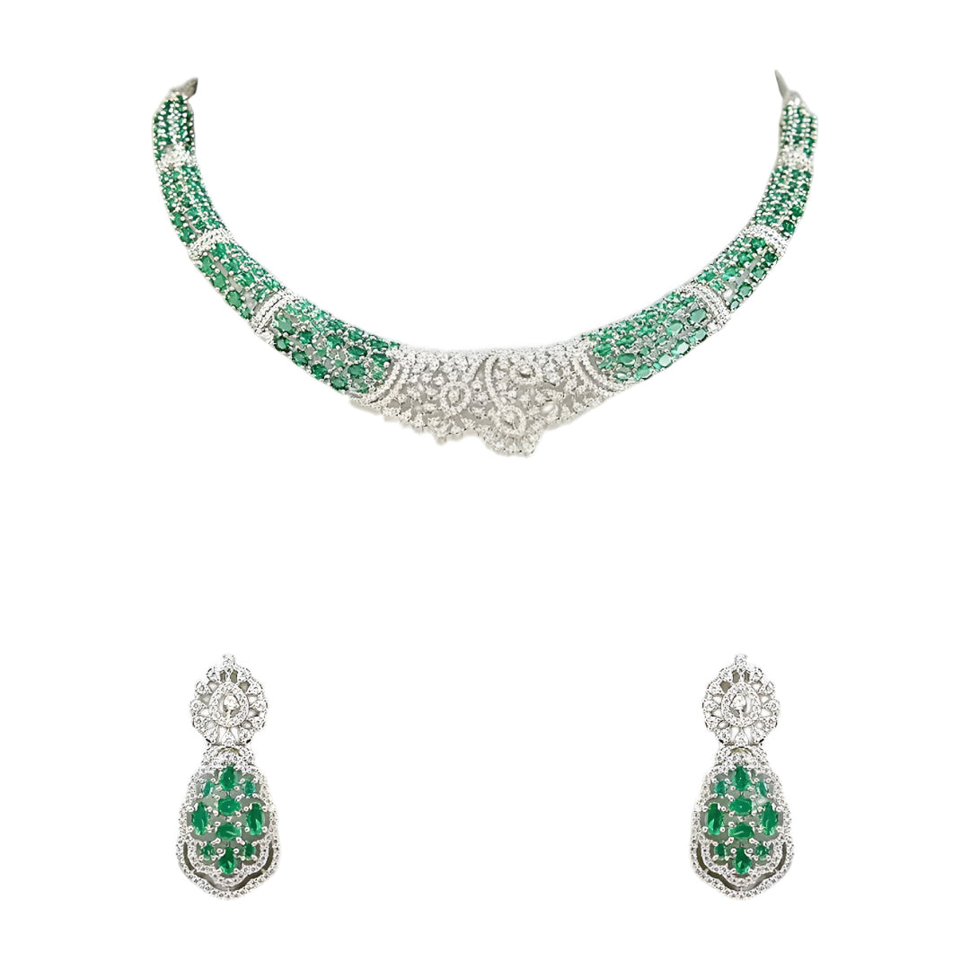Silver-toned emerald green crystal choker necklace set featuring sparkling stone detailing and matching statement drop earrings on a white background.
