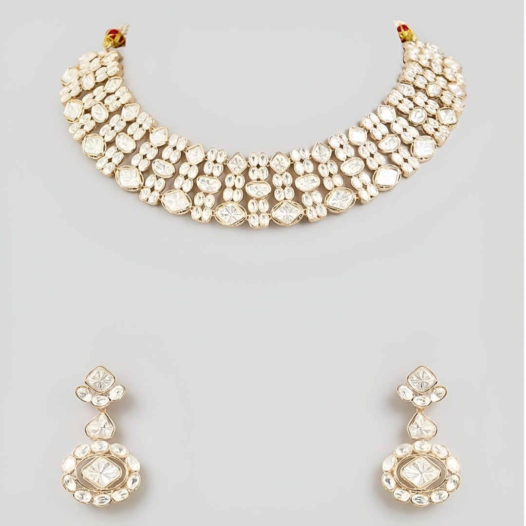 Gold-tone Kundan choker necklace set with matching earrings featuring white uncut-style stones, ideal for bridal, wedding, and festive wear.